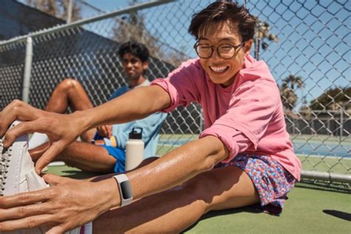 A user wearing a Fitbit Sense utilizes the devices EDA sensor.