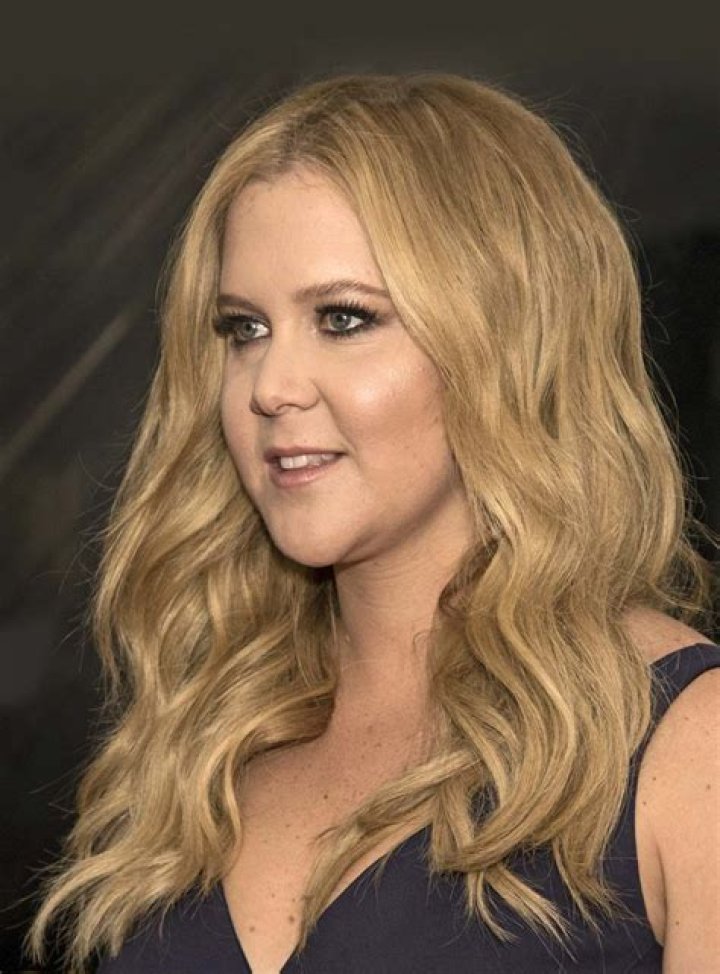 Amy Schumer performs on stage.