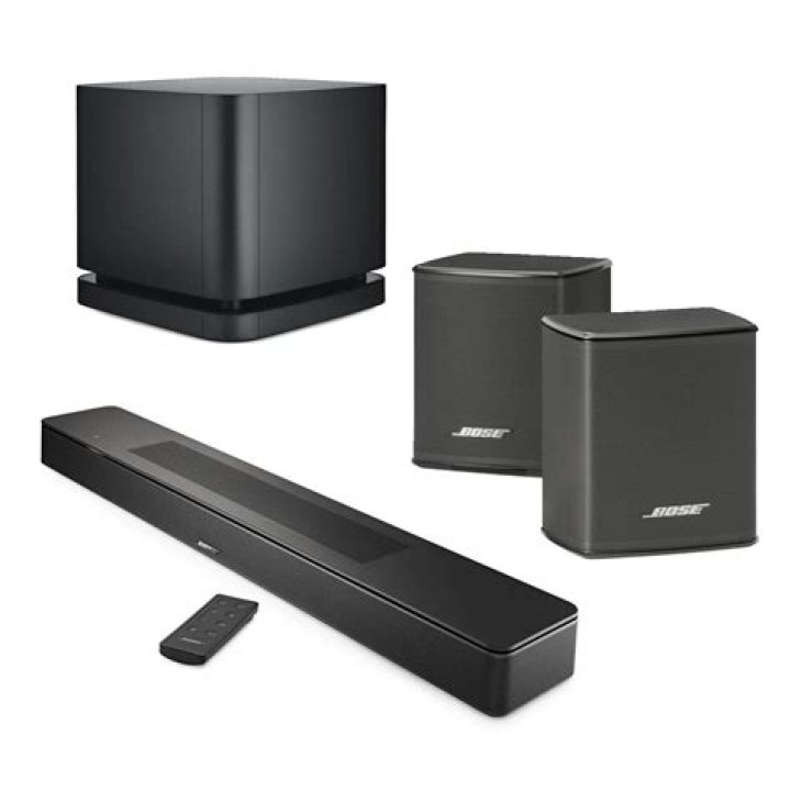 Bose_Home Speaker 500 Bose smart speaker soundbars: A product image of the Bose Home Speaker 500 from the Bose press release. The speaker rests on a white table with a bit of clutter in the background.