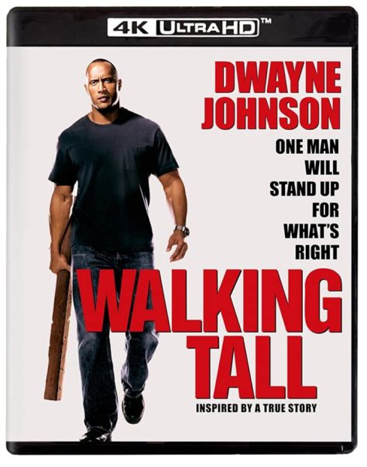 Dwayne Johnson walking in a blue tank top
