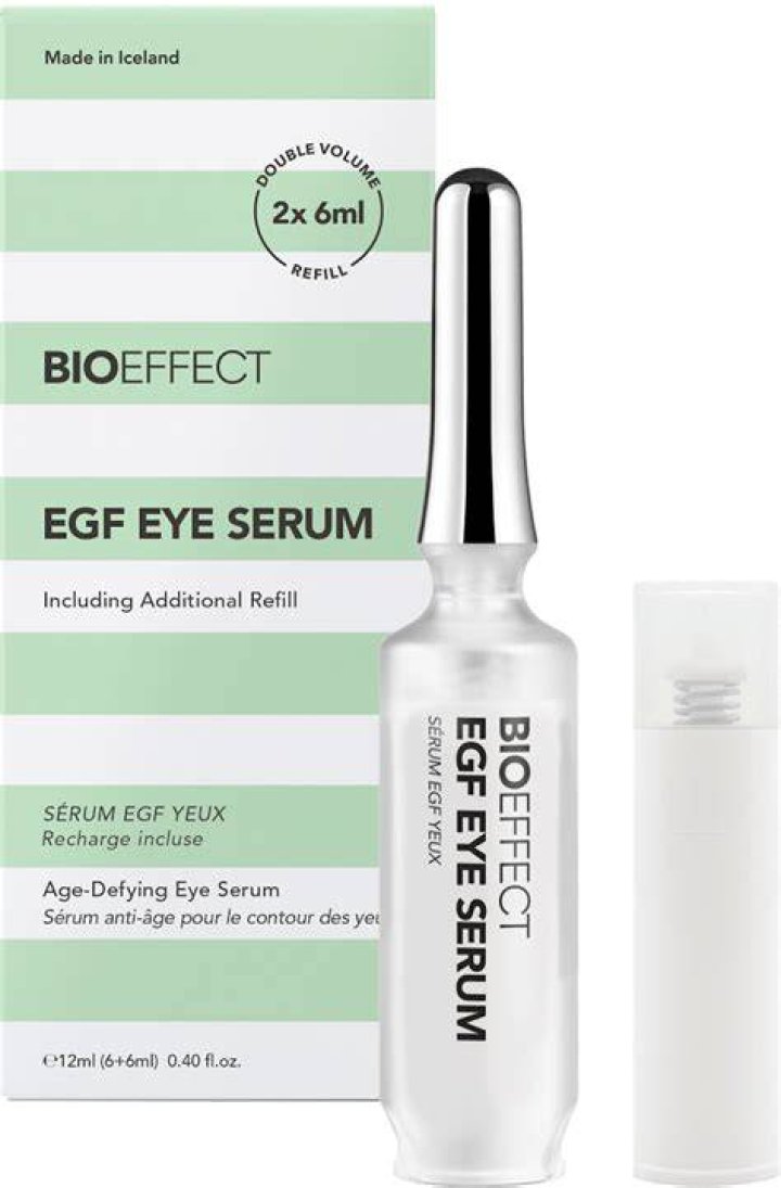 Eye serum with a green pump and cap.