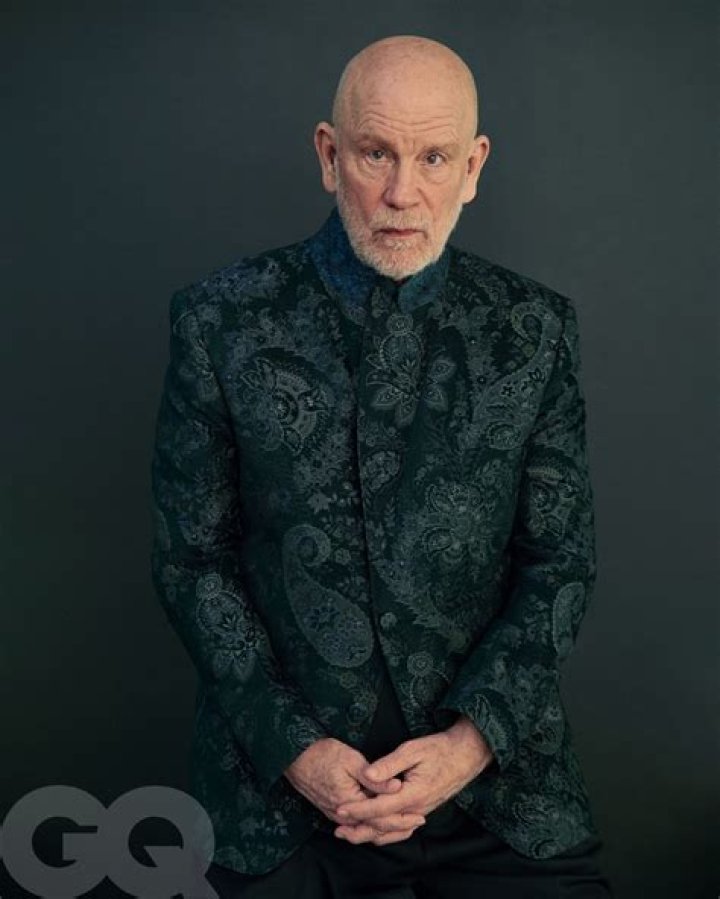 John Malkovich rests head on his hand