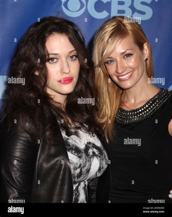 Kat Dennings, Beth Behrs wearing waitress costumes