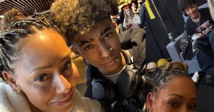 Mel B waving in a crowd outside