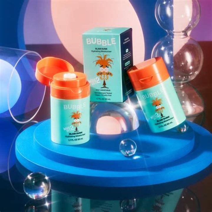 Model holding Bubble Skincare's Day Dream Vitamin C Serum and a product shot of the face serum