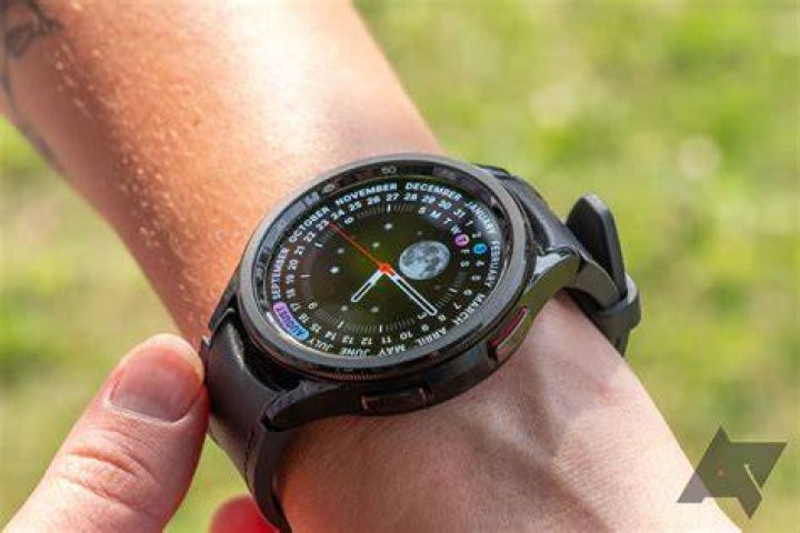 Galaxy Watch 4 Charging Samsung Galaxy Watch 4 rests on a beige cushion while charging.