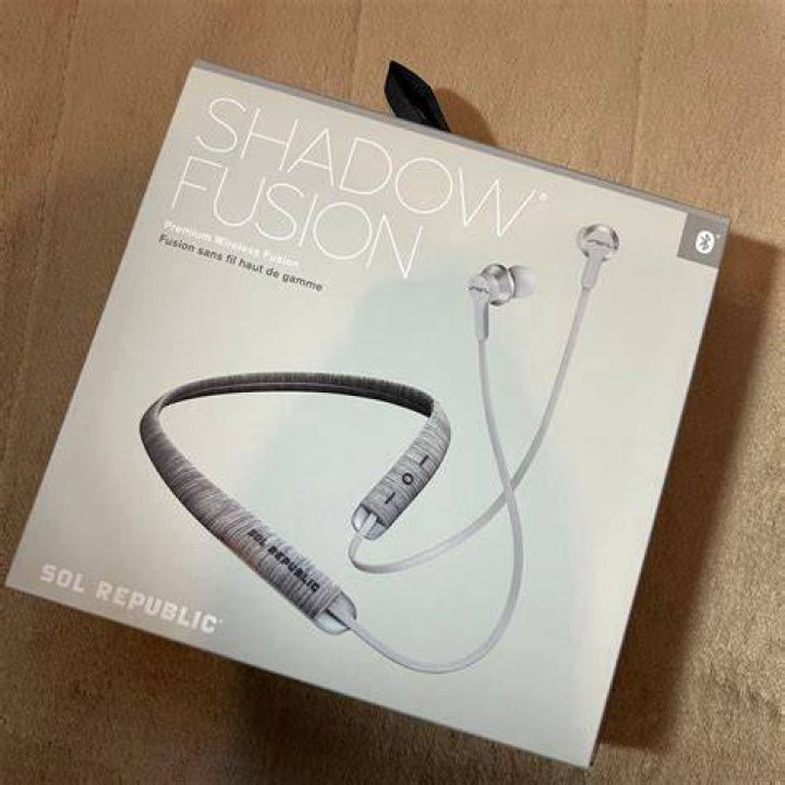 Sol Republic Shadow Fusion with Tile wireless neckband earbuds in blue on white background.