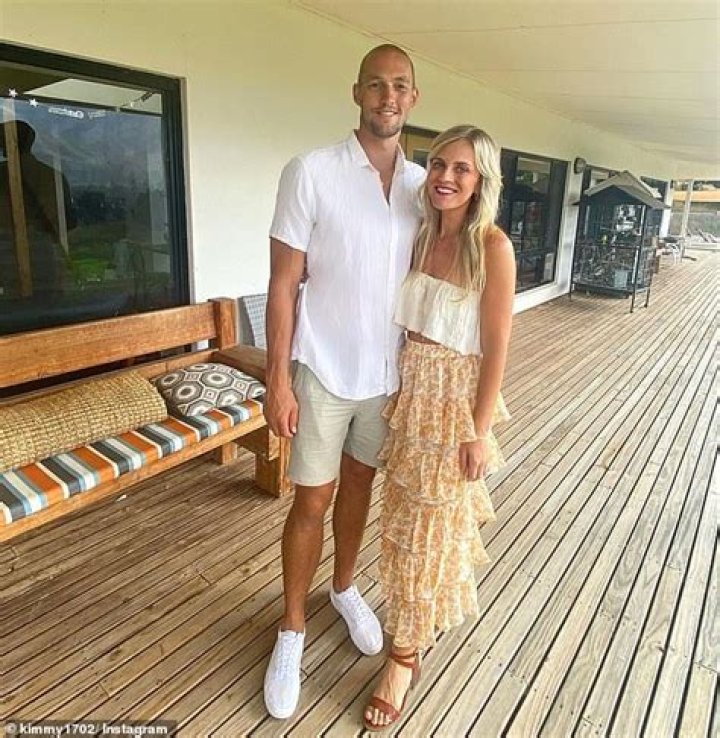 Sydney Swans player Sam Reid and his wife Kim celebrate their children