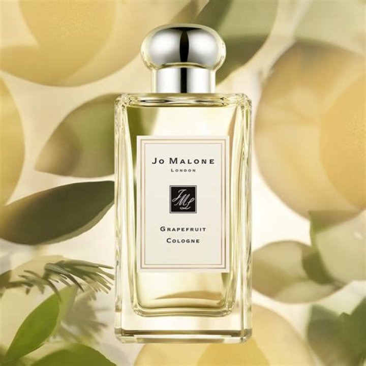 Two Jo Malone perfumes in front of a gift box.