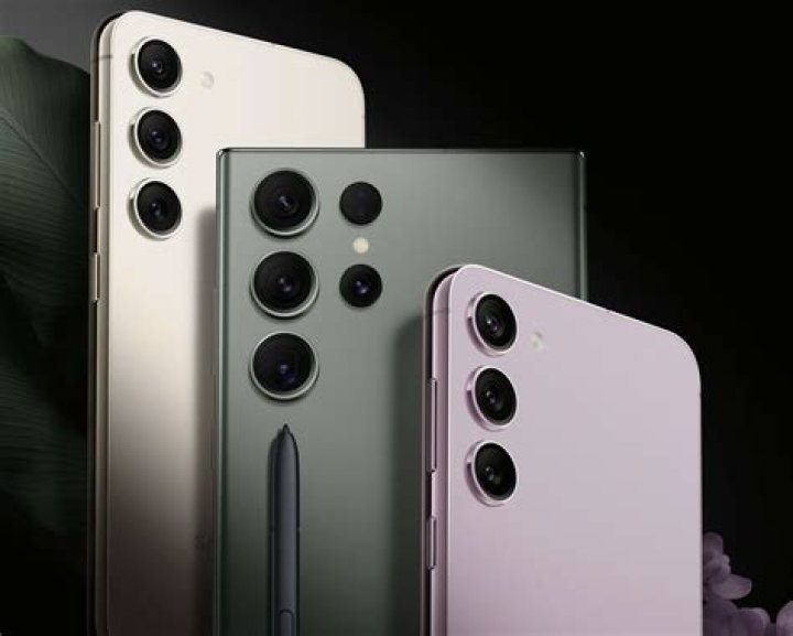 User turns on the Samsung Galaxy Watch 4 by holding down the top button.